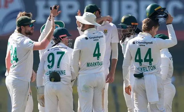 South Africa's players celebrate the dismissal of India's captain Rishab Pant on the fifth day of the second cricket test match between India and South Africa in Guwahati, India, Saturday, Nov. 22, 2025. (AP Photo/Anupam Nath)