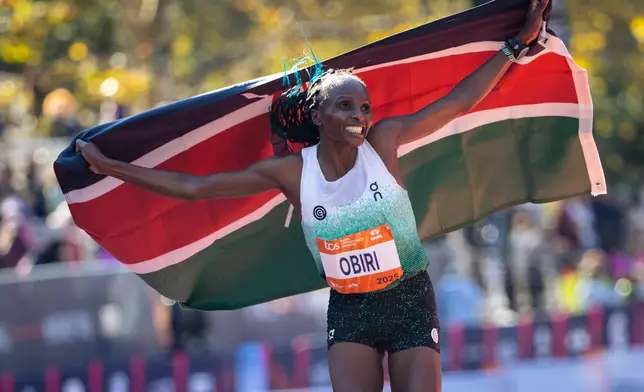 Hellen Obiri celebrates winning first place in the women's elite division of the New York City Marathon, Sunday, Nov. 2, 2025, in New York. (AP Photo/Angelina Katsanis)