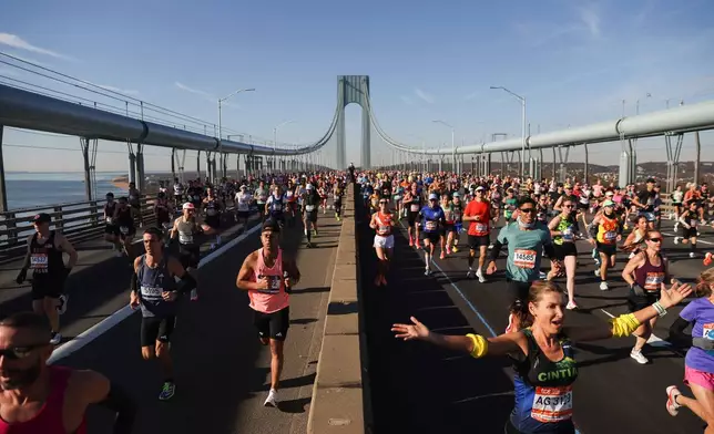 Runners make their way across the Verrazzano Narrows Bridge during the New York City Marathon, Sunday, Nov. 2, 2025, in New York. (AP Photo/Heather Khalifa)