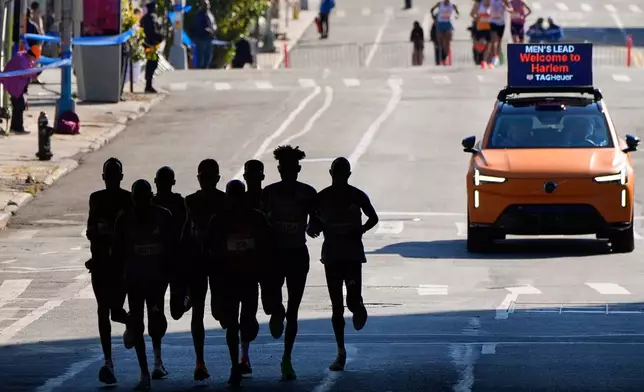 Runners in the men's elite division pass through the Bronx borough during the New York City Marathon, Sunday, Nov. 2, 2025, in New York. (AP Photo/Yuki Iwamura)