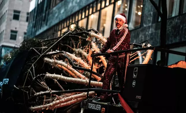 The Rockefeller Center Christmas tree arrives at Rockefeller Plaza, Saturday, Nov. 8, 2025, in New York. (AP Photo/Eduardo Munoz Alvarez)