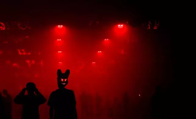 People attend a Halloween rave in Kyiv, Ukraine, Saturday, Oct. 25, 2025. (AP Photo/Julia Demaree Nikhinson)