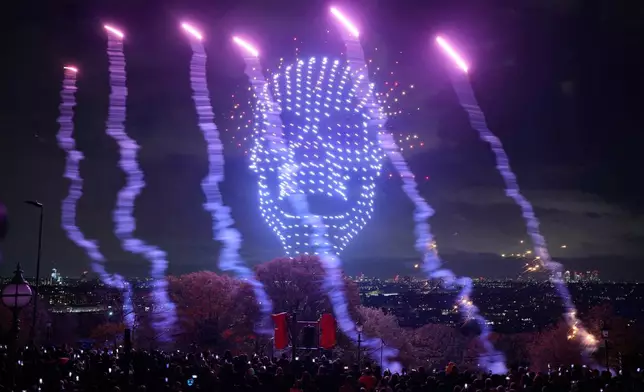 Drones perform over central London to celebrate Halloween in London, Friday, Oct. 31, 2025. (AP Photo/Kin Cheung)