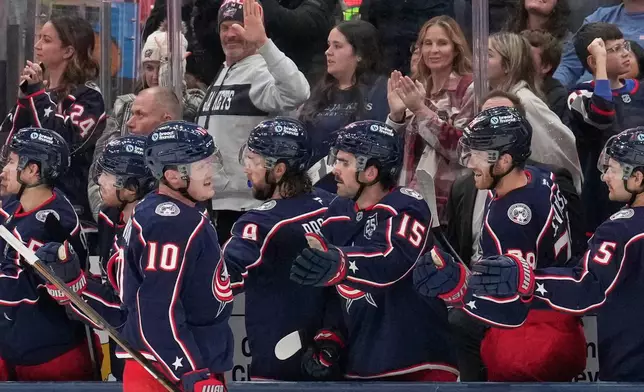 Columbus Blue Jackets left wing Dmitri Voronkov (10) celebrates his goal with teammates in the second period of an NHL hockey game against the Montreal Canadiens in Columbus, Monday, Nov. 17, 2025. (AP Photo/Sue Ogrocki)