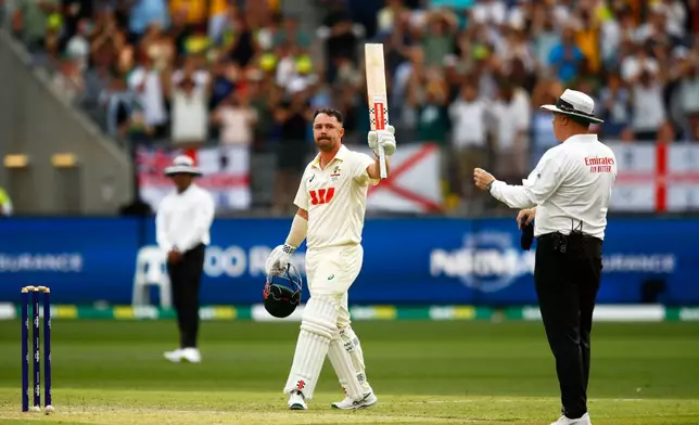 Australia's Travis Head celebrates his century on day two of the first Ashes cricket test match between Australia and England in Perth, Saturday, Nov. 22, 2025.(AP Photo/Gary Day)