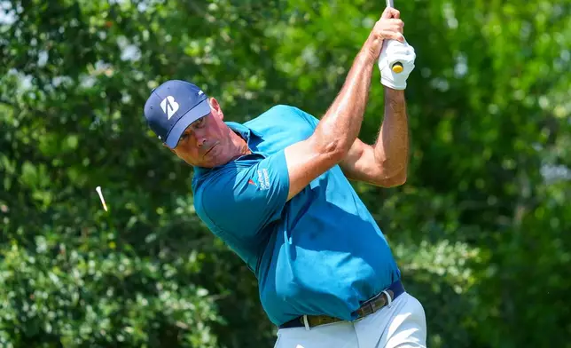 FILE -Matt Kuchar hits off the ninth tee during the first round of the Charles Schwab Challenge golf tournament at Colonial Country Club in Fort Worth, Texas, May 22, 2025. (AP Photo/LM Otero, File)