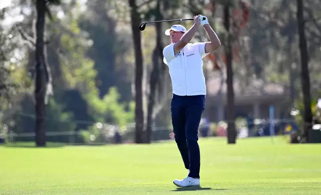 FILE -Steve Stricker hits from the third fairway during the final round of the PNC Championship golf tournament, Dec. 22, 2024, in Orlando, Fla. (AP Photo/Phelan M. Ebenhack, File)