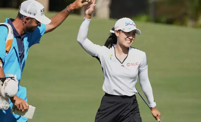 Pajaree Anannarukarn of Thailand reacts after making an eagle putt not he sixth hole during the third round of the LPGA Tour Championship golf tournament, Saturday, Nov. 22, 2025, in Naples, Fla. (AP Photo/Marta Lavandier)