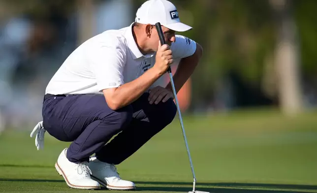 Sam Stevens lines up a putt on the first fairway during the first round of the RSM Classic golf tournament, Thursday, Nov. 20, 2025, in St. Simons Island, Ga. (AP Photo/Mike Stewart)