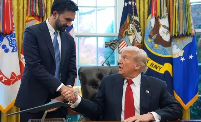 President Donald Trump shakes hands with New York City Mayor-elect Zohran Mamdani in the Oval Office of the White House, Friday, Nov. 21, 2025, in Washington. (AP Photo/Evan Vucci)