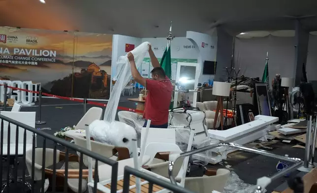 The pavilion area of the COP30 U.N. Climate Summit is packed up as negotiations continue, Saturday, Nov. 22, 2025, in Belem, Brazil. (AP Photo/Fernando Llano)