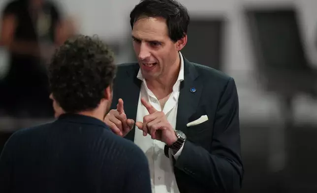 Wopke Hoekstra, EU climate commissioner, speaks with delegates as he waits for the start of a plenary session at the COP30 U.N. Climate Summit, Saturday, Nov. 22, 2025, in Belem, Brazil. (AP Photo/Fernando Llano)
