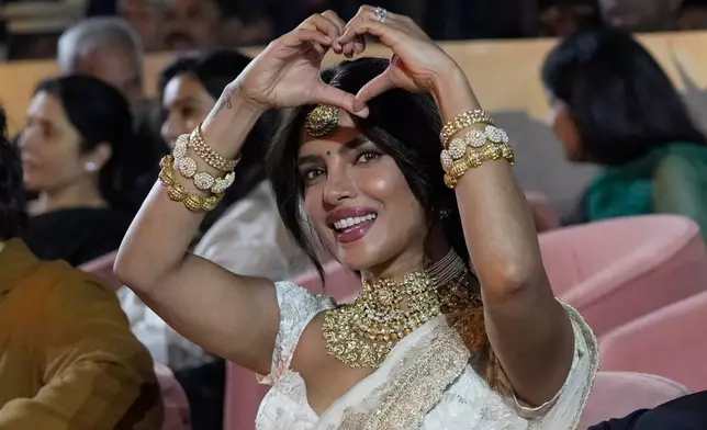 Actress Priyanka Chopra Jonas gesture her fans before unveiling of first look of film "Varanasi" in Hyderabad, India, Saturday, Nov. 15, 2025. (AP Photo/Mahesh Kumar A.)
