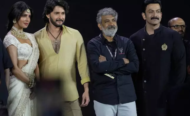 Filmmaker S.S. Rajamouli, third from left, with Telugu superstar Mahesh Babu, actress Priyanka Chopra Jonas and actor Prithviraj Sukumaran, extreme right, pose for photograph after unveiling of first look of film "Varanasi" in Hyderabad, India, Saturday, Nov. 15, 2025. (AP Photo/Mahesh Kumar A.)