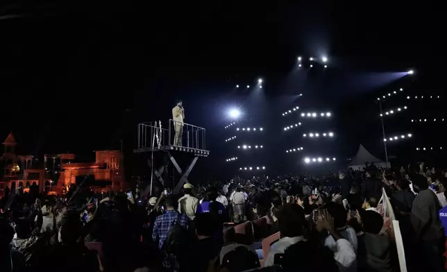 Tollywood superstar Mahesh Babu addresses his fans after unveiling the first look of the film "Varanasi" in Hyderabad, India, Saturday, Nov. 15, 2025. (AP Photo/Mahesh Kumar A.)