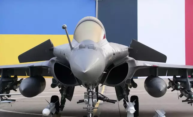 A Rafale jet fighter is seen before the arrival of Ukrainian President Volodymyr Zelenskyy Monday, Nov. 17, 2025 at the Villacoublay air base near Paris. (AP Photo/Christophe Ena, Pool)