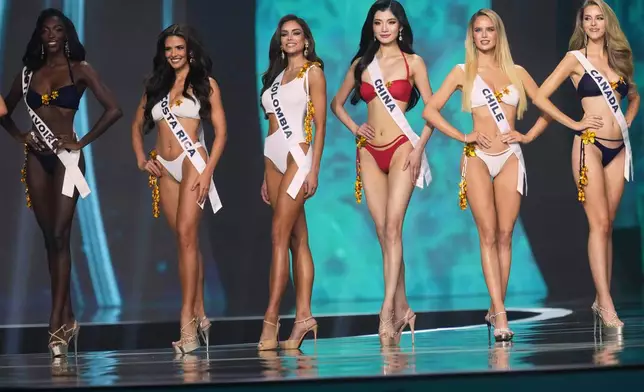 Contestants take part in the final round of the 74th Miss Universe Beauty Pageant in Nonthaburi province, Thailand, Friday, Nov. 21, 2025. (AP Photo/Sakchai Lalit)
