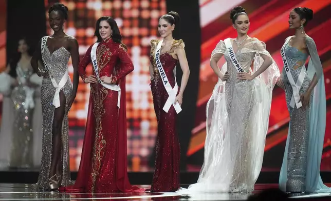 Finalists pose for the jury during the final round of the 74th Miss Universe Beauty Pageant in Nonthaburi province, Thailand, Friday, Nov. 21, 2025. (AP Photo/Sakchai Lalit)