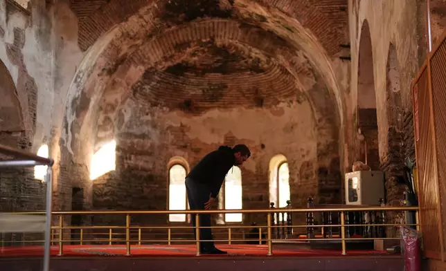 A Muslim prays at Hagia Sophia mosque, in Iznik, also known by its ancient name Nicaea, northwestern Turkey, Thursday, Nov. 13, 2025, ahead of the visit of Pope Leo XIV to the city to mark the 1,700th anniversary of the First Council of Nicaea. (AP Photo/Francisco Seco)