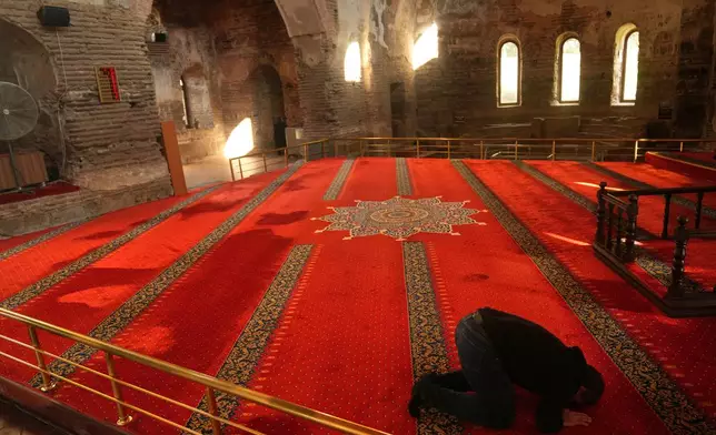 A Muslim prays at Hagia Sophia mosque, in Iznik, also known by its ancient name Nicaea, northwestern Turkey, Thursday, Nov. 13, 2025, ahead of the visit of Pope Leo XIV to the city to mark the 1,700th anniversary of the First Council of Nicaea. (AP Photo/Francisco Seco)