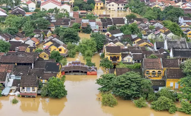 Flooding submerges houses in Hoi An ancient town, Vietnam, Thursday, Oct. 30, 2025. (Phan Anh Dung/VNA via AP)
