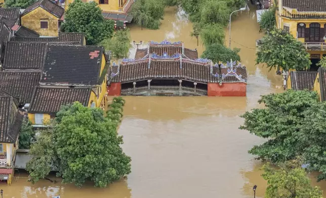 Flooding submerges houses in Hoi An ancient town, Vietnam, Thursday, Oct. 30, 2025. (Phan Anh Dung/VNA via AP)
