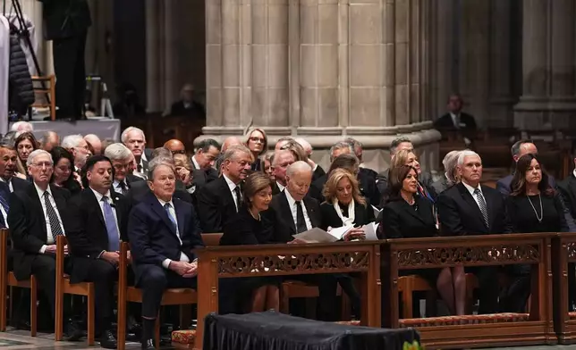 Former Presidents front row from left, George W. Bush with Laura Bush, Joe Biden with Jill Biden and former Vice Presidents Kamala Harris and Mike Pence with Karen Pence, front right, and other invited guests, are seated during the funeral for former Vice President Dick Cheney at the Washington National Cathedral on Thursday, Nov. 20, 2025 in Washington. (AP Photo/Matt Rourke)