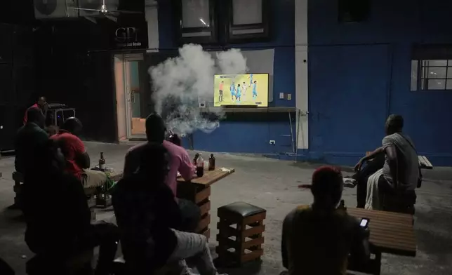 Fans watch a 2026 FIFA World Cup qualifying match between Haiti and Nicaragua, in Port-au-Prince, Haiti, Tuesday, Nov. 18, 2025. (AP Photo/Odelyn Joseph)