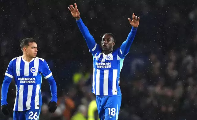 Brighton and Hove Albion's Danny Welbeck, right, celebrates scoring during the English Premier League match between Brighton and Hove Albion and Brentford in Brighton, England, Saturday Nov. 22, 2025. (John Walton/PA via AP)