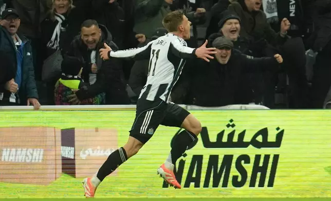 Newcastle's Harvey Barnes runs after scoring during a Premier League soccer match between Newcastle United and Manchester City in Newcastle, England, Saturday, Nov. 22, 2025. (AP Photo/Jon Super)