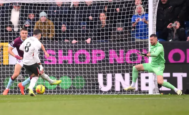 Chelsea's Enzo Fernandez, second from left, scores their side's second goal during the English Premier League soccer match between Burnley v Chelsea, in Burnley, England, Saturday, Nov. 22, 2025. (Gary Oakley/PA via AP)