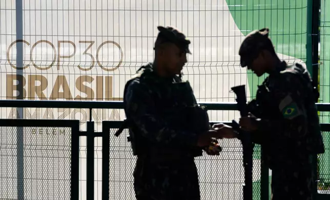 Soldiers patrol in City Park, the site of the COP30 U.N. Climate Summit, in Belem, Para state, Brazil, Tuesday, November 4, 2025. (AP Photo/Eraldo Peres)