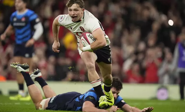 Wales' Dan Edwards on his way to scoring their side's first goal of the game during the rugby union Nations Series match between Wales and Japan at the Principality Stadium, Cardiff, Saturday, Nov. 15, 2025. (Andrew Matthews/PA via AP)