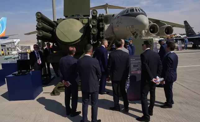 Businessmen look at a Russian Pantzir-SMD-E surface-to-air missile system at the Dubai Air Show in Dubai, United Arab Emirates, Monday, Nov. 17, 2025. (AP Photo/ Fatima Shbair)