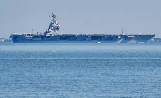 FILE The USS Gerald R. Ford aircraft carrier leaves Naval Station Norfolk, June 23, 2025, in Norfolk, Va. (AP Photo/John Clark, File)