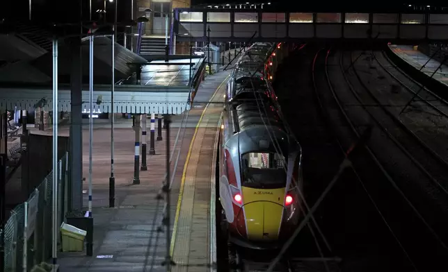 The Huntingdon, England, train station in Cambridgeshire is seen after people were stabbed Saturday, Nov. 1, 2025. (Chris Radburn/PA via AP)