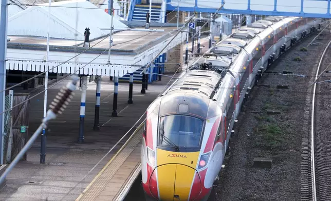 A train is parked at the station after a mass stabbing on a London-bound train in Huntingdon, England, Sunday, Nov. 2, 2025.(AP Photo/Kirsty Wigglesworth)
