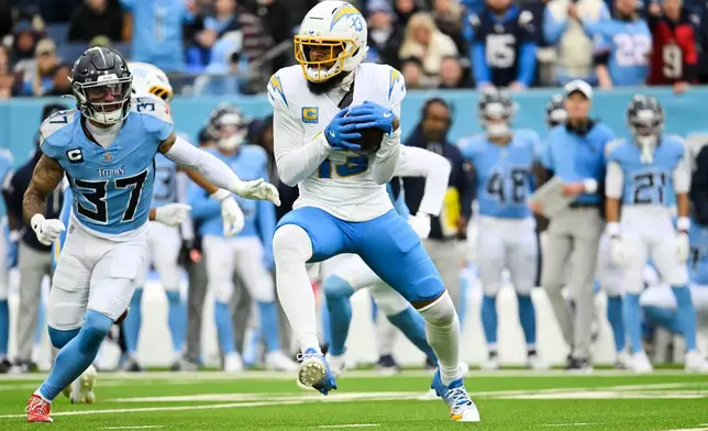 Los Angeles Chargers wide receiver Keenan Allen (13) makes a catch during the second half of an NFL football game against the Tennessee Titans, Sunday, Nov. 2, 2025, in Nashville, Tenn. (AP Photo/John Amis)