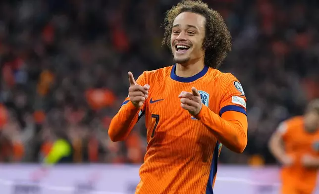 Netherlands' Xavi Simons celebrates scoring his side's 3rd goal during a World Cup 2026 group G qualifying soccer match between Netherlands and Lithuania in Amsterdam, Netherlands, Monday, Nov. 17, 2025. (AP Photo/Peter Dejong)
