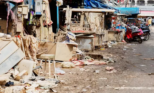 The damaged shops are seen following flooding in Songkhla province, southern Thailand, Saturday, Nov. 29, 2025. (AP Photo/Sarot Meksophawannakul)