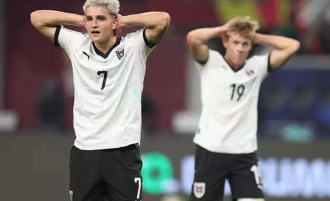 Austria's Nicolas Jozepovic, left, and Johannes Moser react during the FIFA U17 World Cup final soccer match between Portugal and Austria in Doha, Qatar, on Thursday, Nov. 27, 2025. (AP Photo/Hussein Sayed)