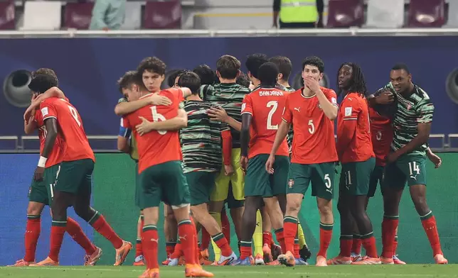 Portugal players celebrate a goal during the FIFA U17 World Cup final soccer match between Portugal and Austria in Doha, Qatar, on Thursday, Nov. 27, 2025. (AP Photo/Hussein Sayed)