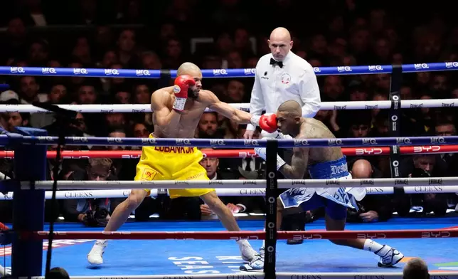 Chris Eubank Jr. left. and Conor Benn battle during a middleweight bout, Saturday, Nov. 15, 2025, in London. (Nick Potts/PA via AP)