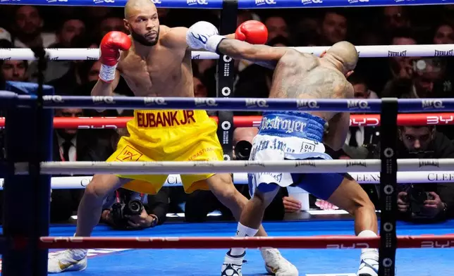 Chris Eubank Jr., left, battles Conor Benn during a middleweight bout, Saturday, Nov. 15, 2025, in London. (Nick Potts/PA via AP)