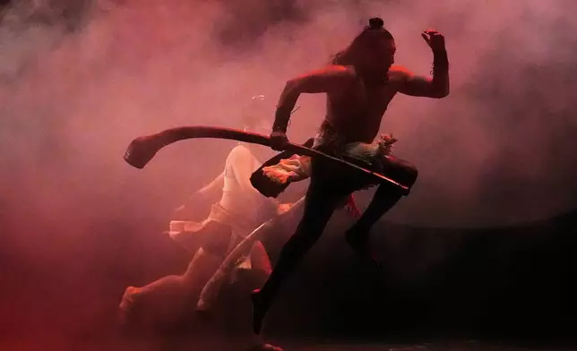 Acrobats from a Mexican theater company perform the show titled "Mortal Leap into Xibalba," which reinterprets a myth from a sacred Mayan book about creation and the journey to the underworld, in Mexico City, Saturday, Nov. 22, 2025. (AP Photo/Marco Ugarte)