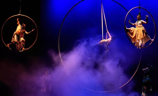 Acrobats from a Mexican theater company perform the show titled "Mortal Leap into Xibalba," which reinterprets a myth from a sacred Mayan book about creation and the journey to the underworld, in Mexico City, Saturday, Nov. 22, 2025. (AP Photo/Marco Ugarte)