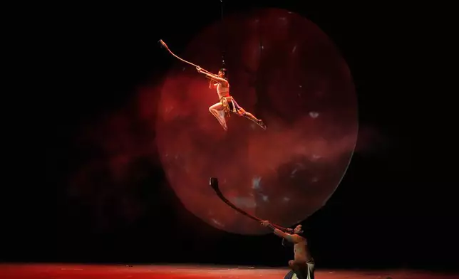 Acrobats from a Mexican theater company perform the show titled "Mortal Leap into Xibalba," which reinterprets a myth from a sacred Mayan book about creation and the journey to the underworld, in Mexico City, Saturday, Nov. 22, 2025. (AP Photo/Marco Ugarte)