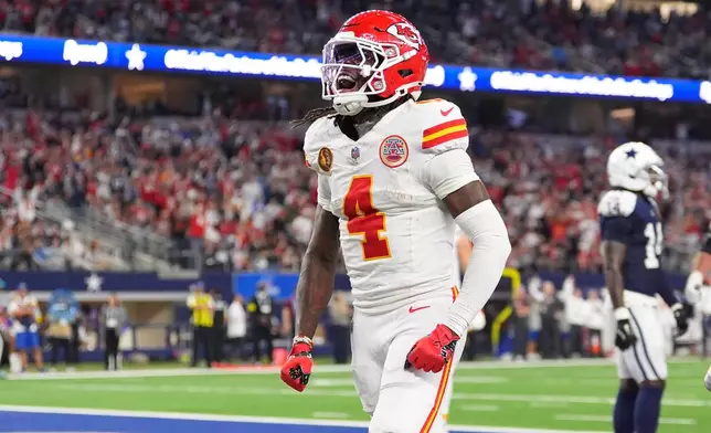 Kansas City Chiefs wide receiver Rashee Rice (4) celebrates after scoring during the second half of an NFL football game against the Dallas Cowboys Thursday, Nov. 27, 2025, in Arlington, Texas. (AP Photo/Tony Gutierrez)