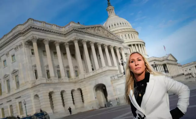 Rep. Marjorie Taylor Greene, R-Ga., arrives to a news conference on the Epstein Files Transparency Act, Tuesday, Nov. 18, 2025, outside the U.S. Capitol in Washington. (AP Photo/Julia Demaree Nikhinson)