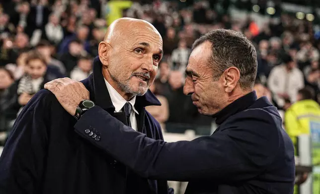 Juventus' head coach Luciano Spalletti, left, and Torino's coach Leonardo Colucci ahead of the Serie A soccer match between Juventus and Torino, in Turin, Italy, Saturday, Nov. 8, 2025. (Marco Alpozzi/LaPresse via AP)